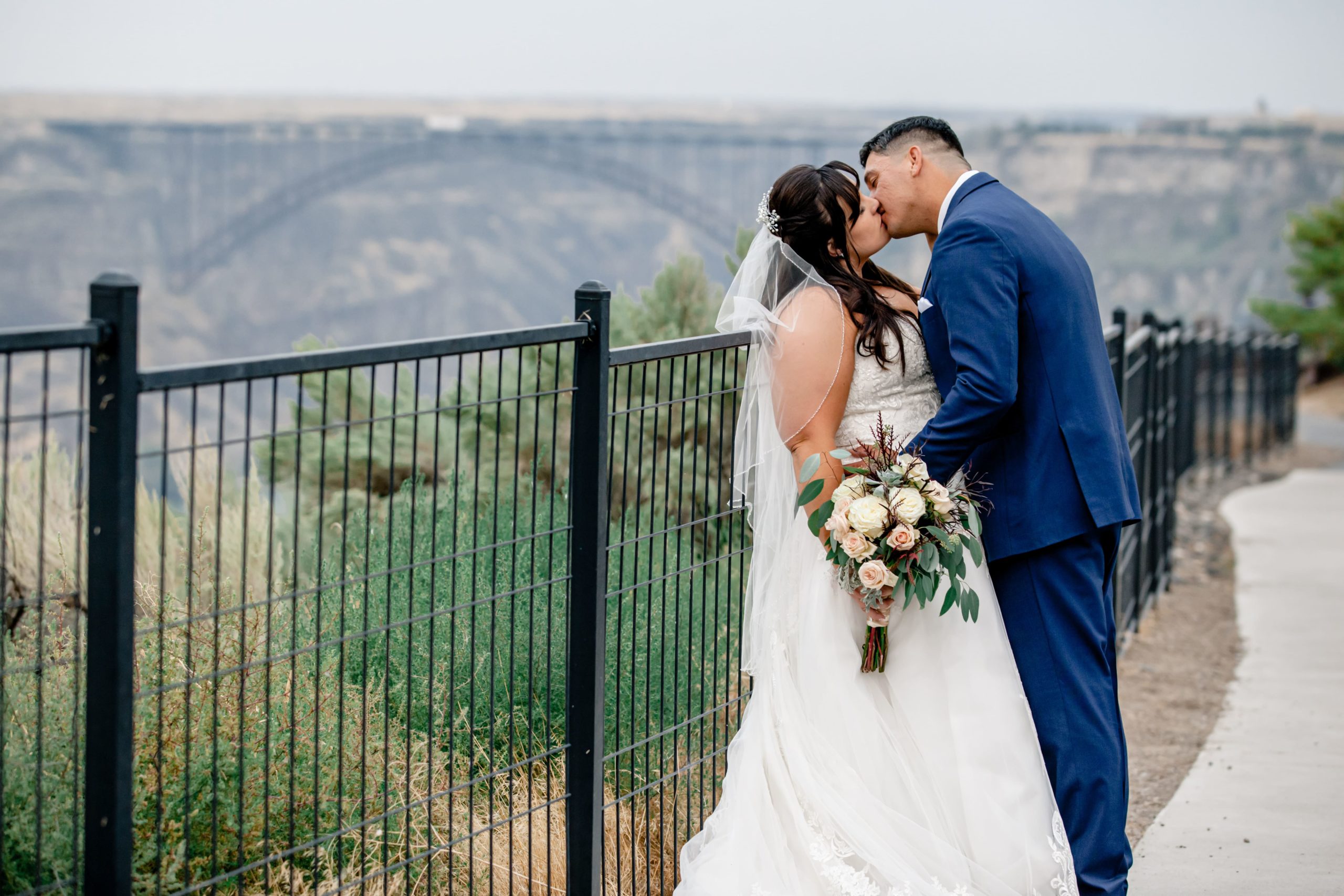 Bride and groom kissing at Canyon Crest Event Center